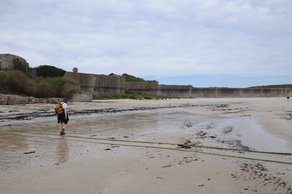The 7ft anti tank wall behind a sandy beach