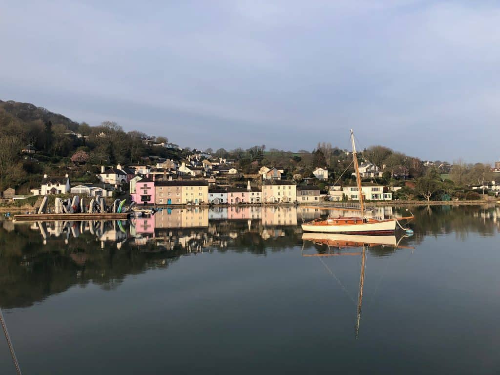 Colourful houses reflecting in the river at Dittisham